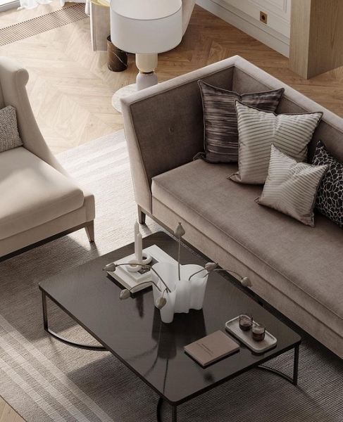 Затишна вітальня Стильний дизайн вітальні з великим коричневим диваном, журнальним столиком та килимом.