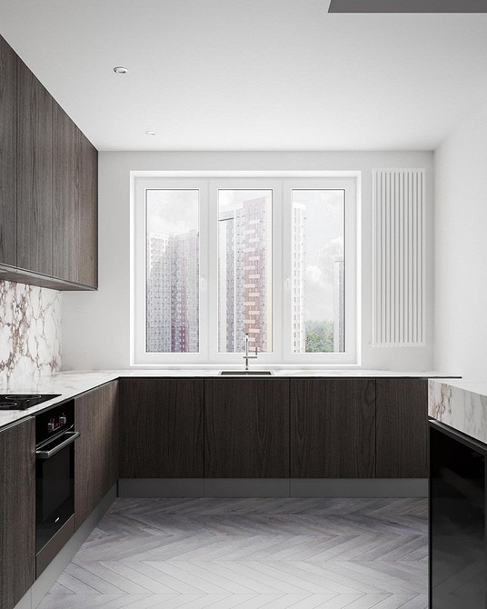 Зручне зберігання Кухня з островом та великою кількістю шаф для зберігання кухонного начиння.